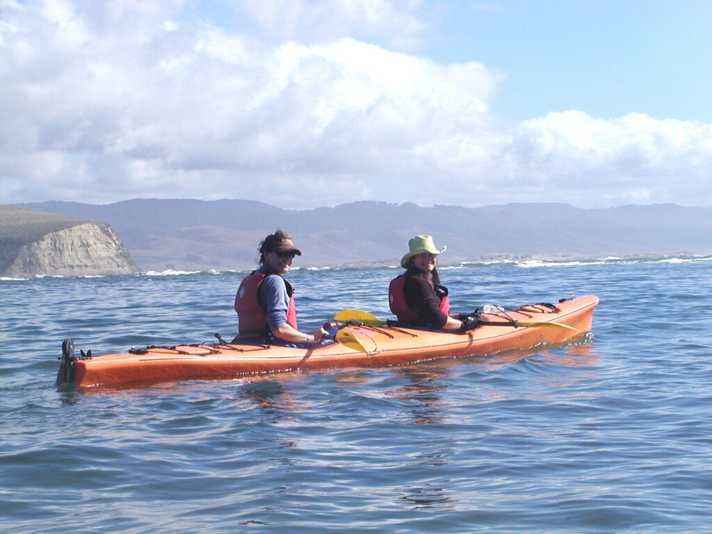 2 girls enjoying kayaking on Tomales Bay